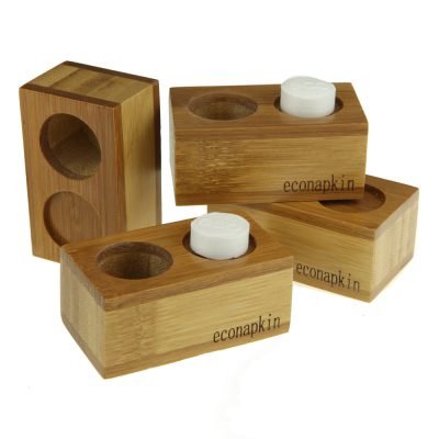 four single bamboo econapkin holders stacked on a white background